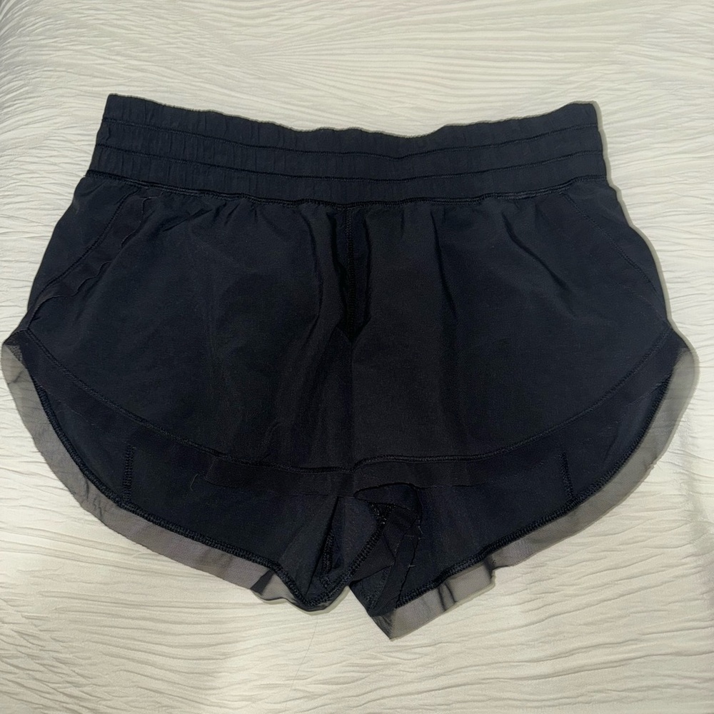Lululemon vintage shorts black in size 8!! Have a fun sheet trim on the edges!!